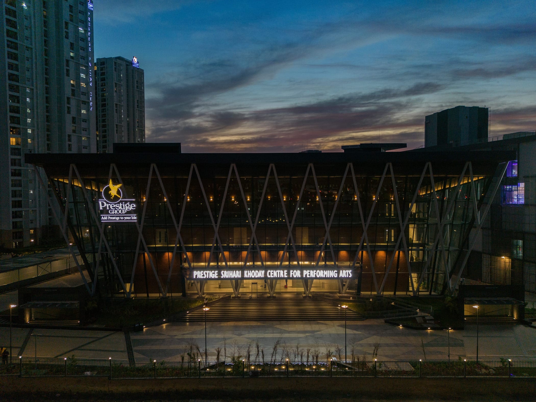 Front entrance view of Prestige Centre for Performing Arts at dusk